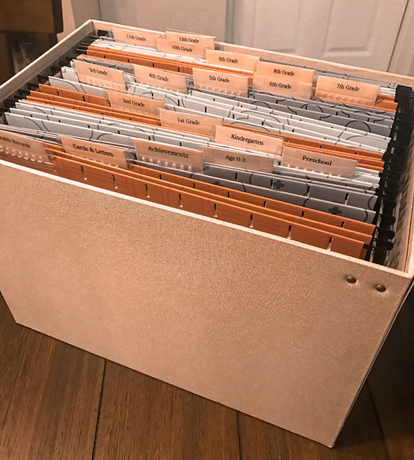 Keepsake bin with organization tabs with labels